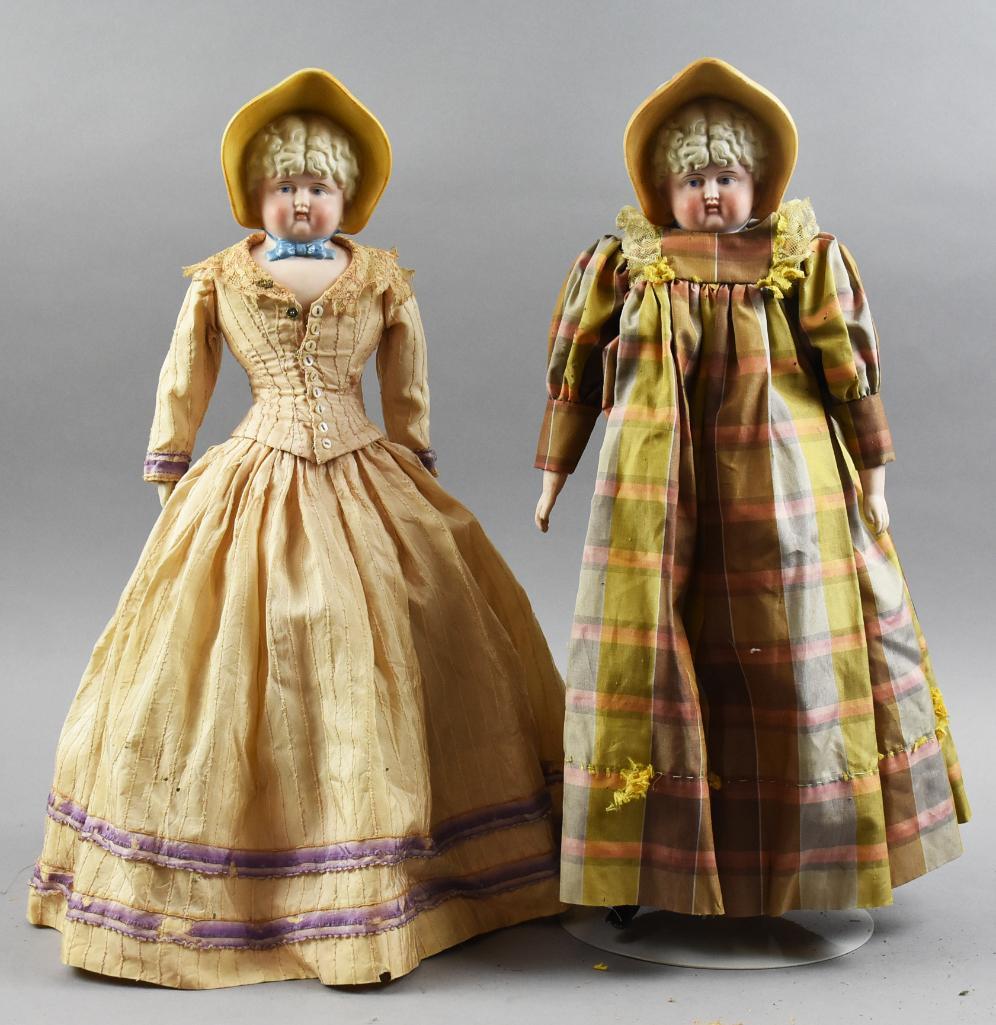 c1900 Parian Blond Doll Twins, Molded Bonnet, 19" & 20"T: These gals look like twins with the same curly hair and molded bonnets. Each has a 2A mark on her back. One is dressed in a period style dress and has what appears to be original body and limbs, the o