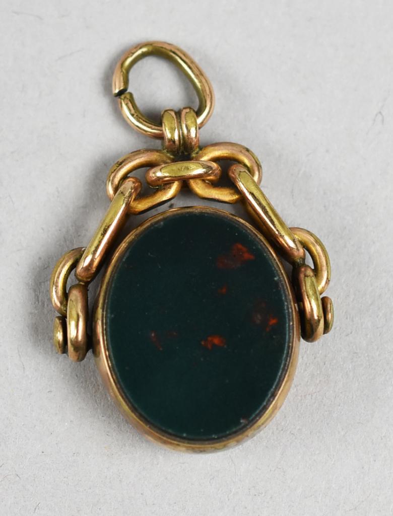 Victorian Gold Filled Bloodstone & Carnelian Swivel Pendant: Wonderful Victorian pendant can be worn on either side. One side is rich bloodstone and the other side is deep red, appears carnelian. No visible marks and measures 1" x 1.5"