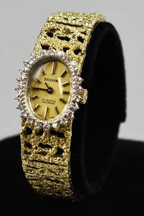 Ducharme 14K Gold & Diamond 17J Ladies Watch: Fantastic vintage ladies wristwatch from Ducharme. It is a 17 jewel incabloc Swiss movement. Brushed gold dial with 24 diamonds set in the bezel. Watch band is pierced and textured with a push button