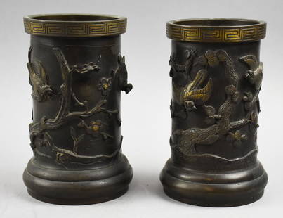 19th C. Japanese Bronze Vases w/ Birds: Stunning pair of 19th century Japanese vases that appear bronze. Each cylindrical vase is birds in trees or flying with polished parts, giving the three dimensional vase a little more depth. No visibl