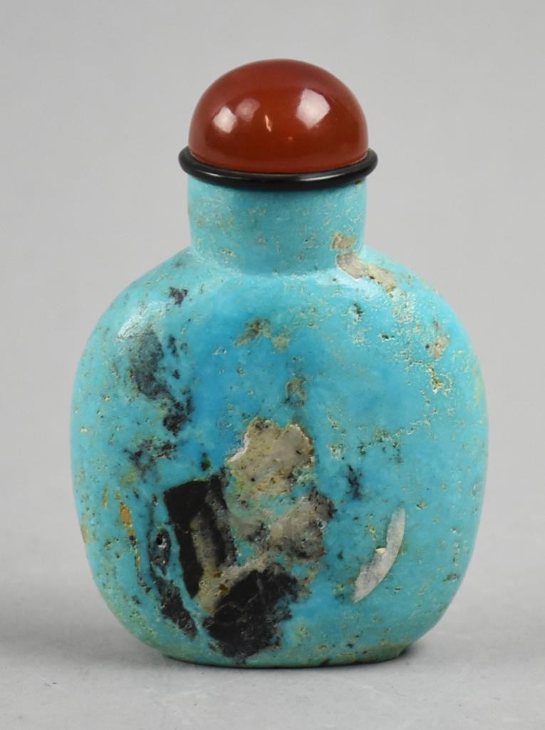 Chinese Turquoise Carved Snuff Bottle, Carnelian Stopper: Wonderful old Chinese snuff bottle appears to be turquoise. Stopper is carnelian with the snuff spoon being bone. Stands approx 3" tall