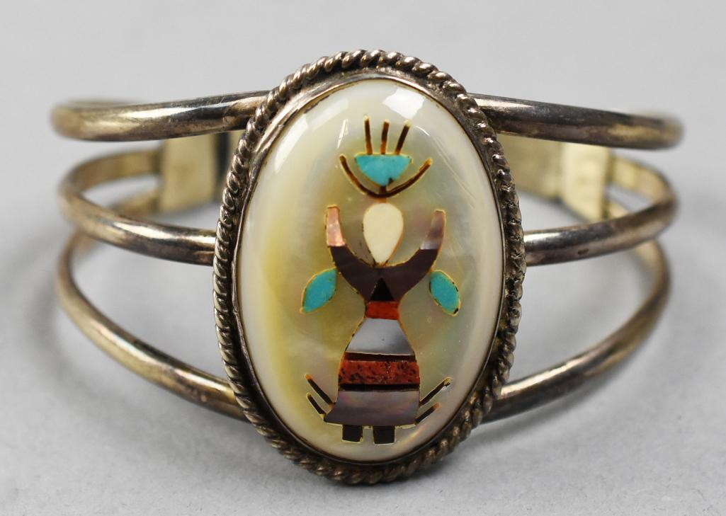 Vintage Gary Nez Navajo Kachina Cuff Bracelet: Great looking vintage Navajo cuff bracelet is believed to be from jewelry artist Gary Nez. Sterling with mother of pearl stone inlaid with turquoise, coral and abalone in the form of a Kachina dancer