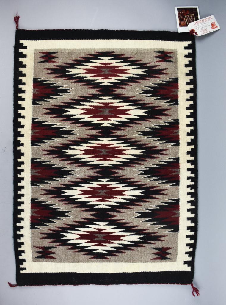 Alice Robinson Navajo Butterfly, Step Woven Rug: This great looking rug is from Navajo artist weaver Alice Robinson. The pattern is identified as Butterfly with Step Border. Comes with the photo of Robinson holding her creation and retains the origi