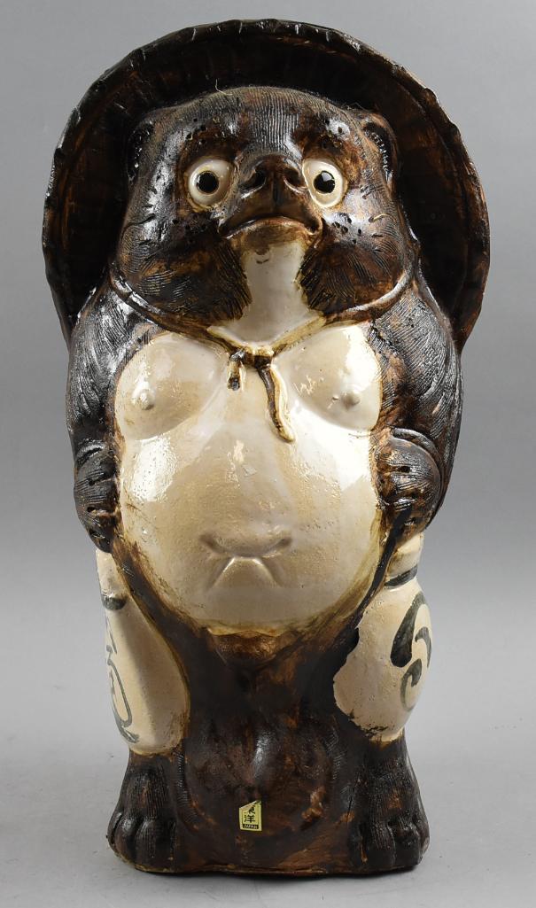 Vintage Japanese Earthenware Tanuki Figurine: Who doesn't love a cute little raccoon dog? This fella is a Japanese tanuki done in what appears to be earthenware. He retains the original foil label from the lte 1960s and stands approx. 19" tall