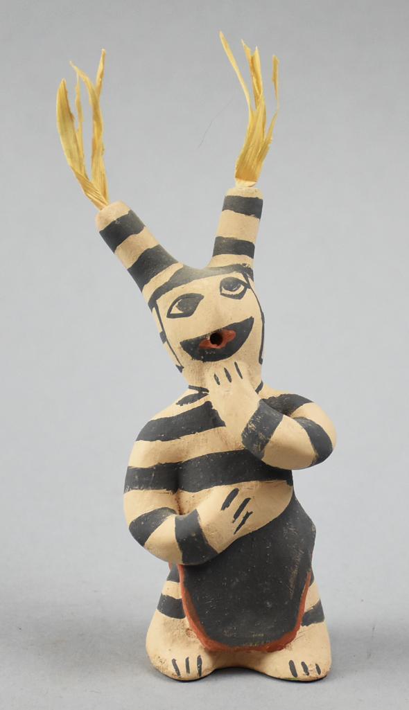 Cass Toya, Jemez Pottery Clown Figurine: This goofy little fella is a Jemez pottery clown. He has hand painted features and clothes with what appears to be straw coming out the top. Signed C. Toya, for Cass Toya, Jemez, NM. Stands approx 6"