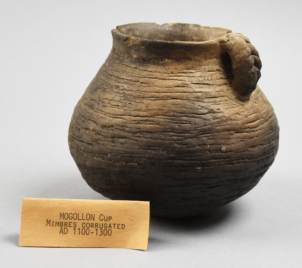 1100-1300 AD Mogollon Mimbres Corrugated Cup: Remarkable piece of Native American pottery in the cup. It is of the Mogollon (Central Arizona and New Mexico) culture, 1100-1300 AD. Mimbres corrugated, coiled and incised. Stands approx 5" tall. N