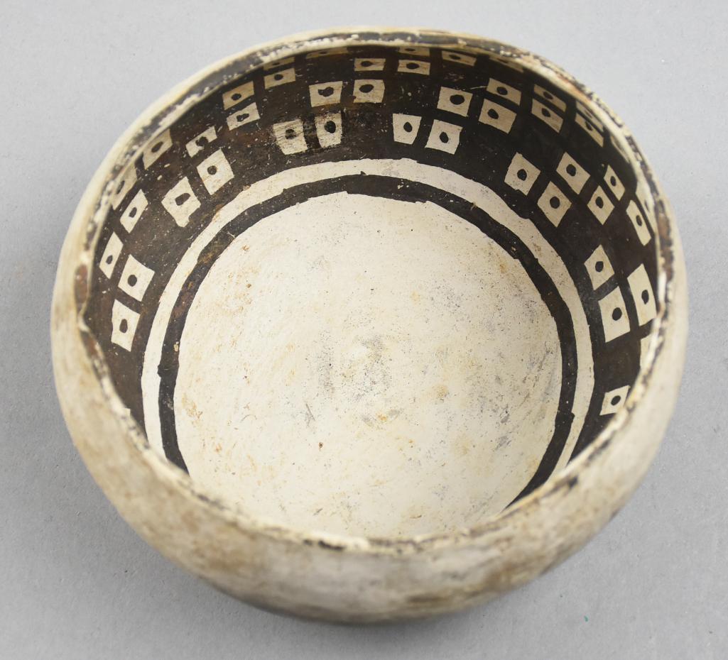 1180-1300 AD Anasazi Kana'a Black on White Bowl: Stunning bowl is from the Anasazi (Northwestern Arizona) culture dating 1180-1300 AD, Kana'a black on white, plain outside and checkerboard with dots in. Measures approx 4.5" tall x 5.5" wide. NOTE: F