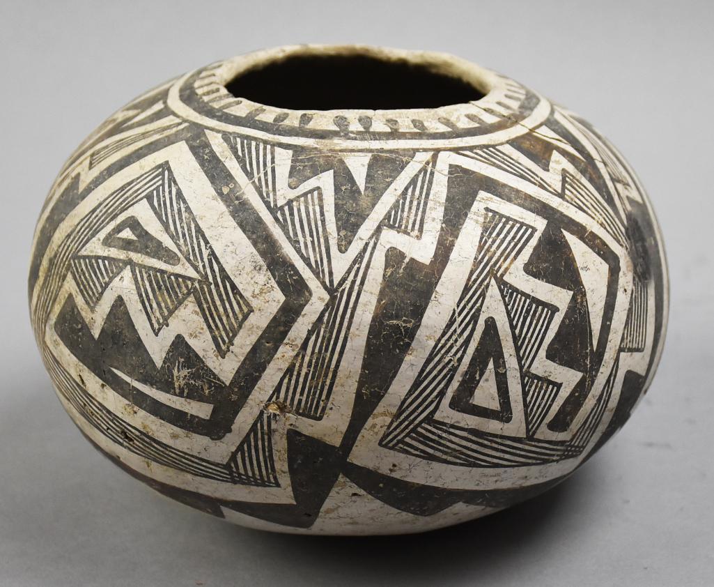 1100-1250 AD Mogollon Tularosa Snowflake Black-White Jar: This remarkable piece is of Mogollon culture, Tularosa dating from 1100-1250 AD. Snowflake jar with geometric lines and shapes on white. Stands approx 5.5" tall. NOTE: From the collection of Daniel Cu