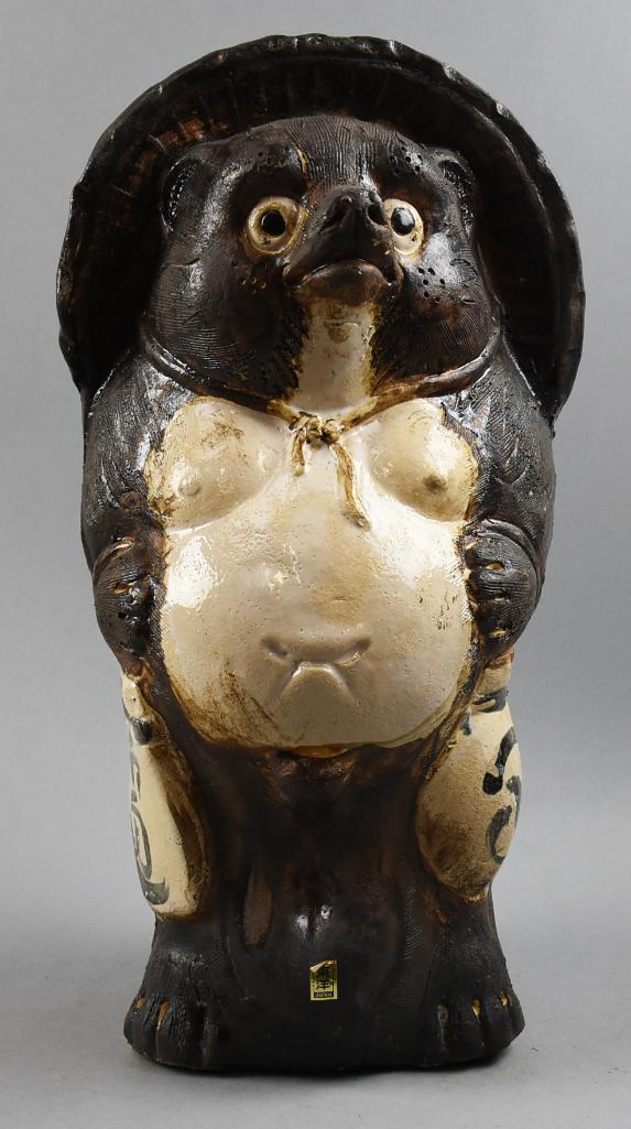 Vintage Japanese Earthenware Tanuki Figurine: Who doesn't love a cute little raccoon dog? This fella is a Japanese tanuki done in what appears to be earthenware. He retains the original foil label from the lte 1960s and stands approx. 19" tall.