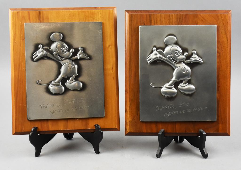 Vtg Wood & Pewter Disney Cast Member Retirement Plaques: These are a pair of great retirement plaques to cast members Bob and Irene (Fleetwood). Each is Mickey with dedication on pewter which are attached to wooden frames. Both approx. 11" x 13". Collecti