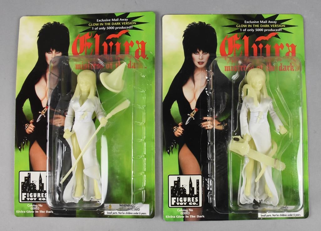 Lt Ed Elvira Glow in the Dark Action Figures-Carded-NOS: 1998 limited edition Elvira Glow in the Dark Action Figures-Carded-NOS. One with broom and one with chainsaw. From the boy with the most toys! From the home of the largest toy collector on the west co