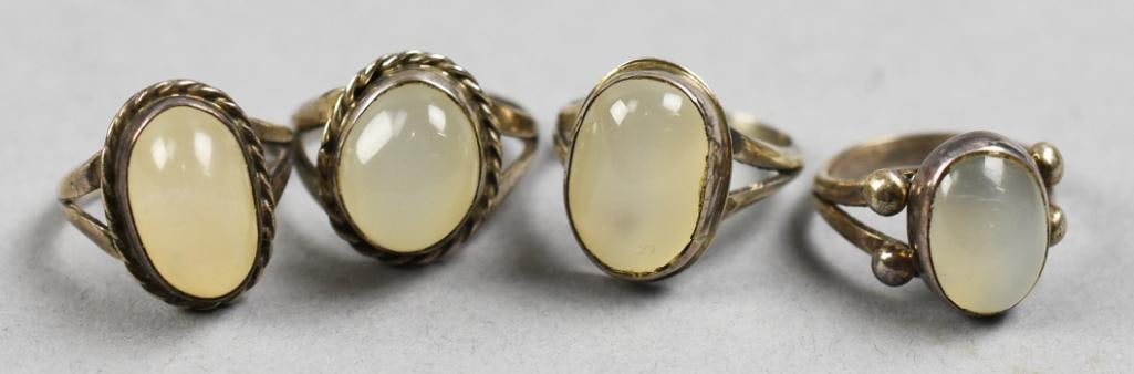 (4) Vintage Sterling and Moonstone Rings: Beautiful grouping of solid sterling rings set with large moonstones. Each is stamped sterling with no other visible markings. Overall approx weight of 14g. Sizes range from 5 to 7.