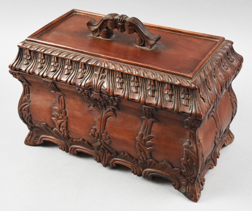 Vintage Indonesia Lidded Wooden Box: Lovely vintage wooden box with Victorian style carvings and ornate handle. Inside removable tray for additional storage. Marked on the bottom with Made in Indonesia and additional writing. Measu