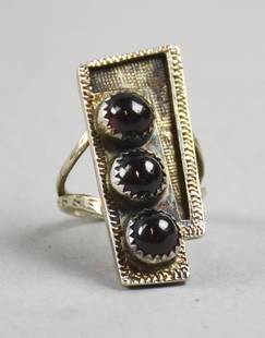 Vintage Lee Prince (Cherokee) Sterling & Garnet Ring: This fantastic ring is sterling with cabochon stones that appear to be garnet. Geometric shapes with hammered texture. Stamped Cherokee Prince LP and Sterling, size approx 7.75.