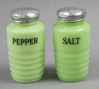 Vintage Jeannette Jadeite Salt and Pepper Shakers: These are great pieces from Jeannette Glass Co. These are from the utility line and are ribbed jadeite glass. Retain original lids that appear aluminum. No visible marks and stand approx. 5" tall.