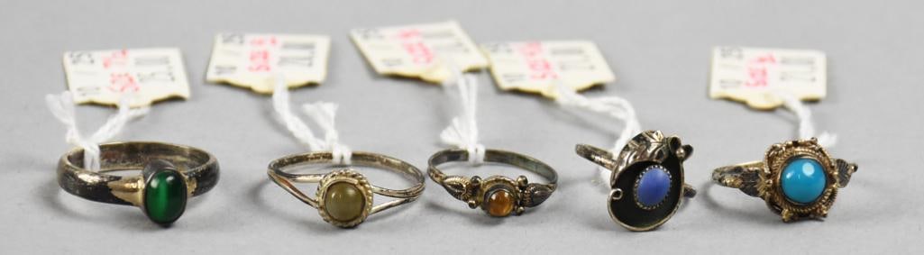 Vintage Native American Style Sterling/Gemstone Rings: Very pretty assortment of sterling rings, each with a different semi precious stone. Stones appear to be turquoise, lapis, cat's eye, amber and malachite. Overall approx weight of 36g.