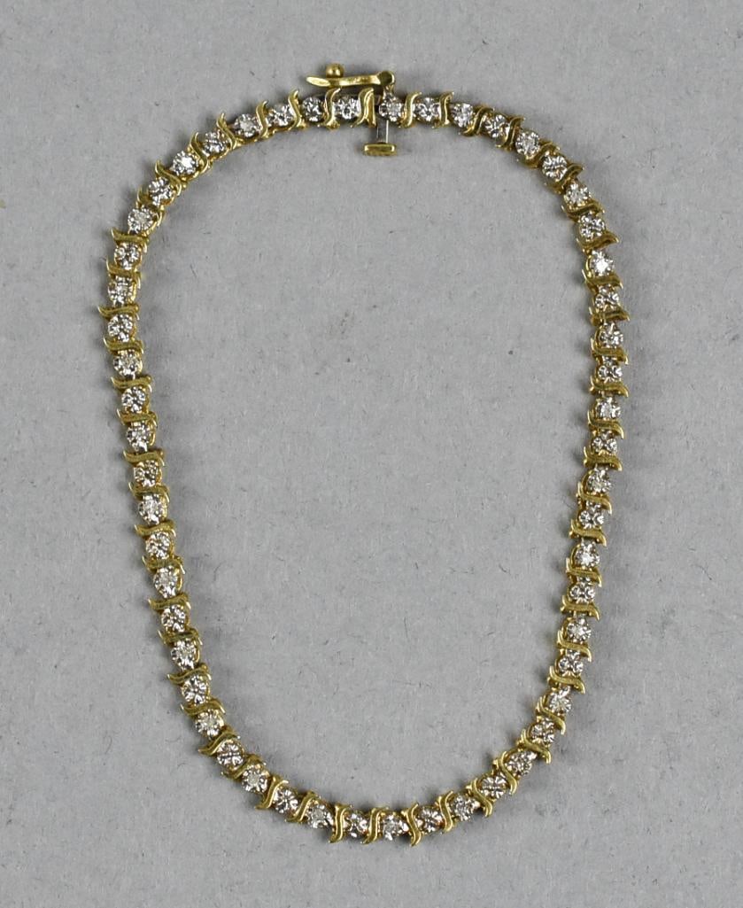 10K Yellow Gold & Diamond Tennis Bracelet: Pretty tennis bracelet of 10K yellow gold with a quarter carat of diamonds.