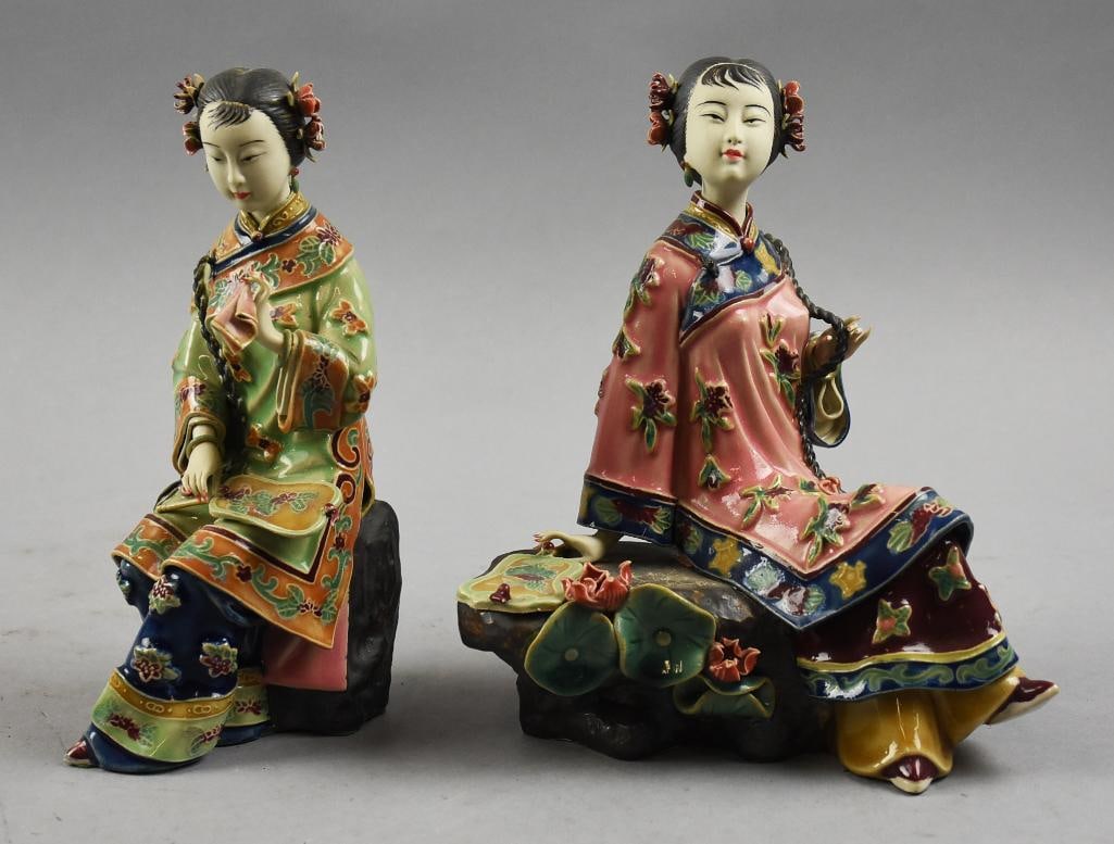 Chinese Wucai Porcelain Noble Ladies Sculptures: Very pretty Chinese wucai porcelain figurines. These young ladies are both seated, one holding a mirror on her lap with hanky in hand, the other is holding her braid. Girl with mirror has an impressed