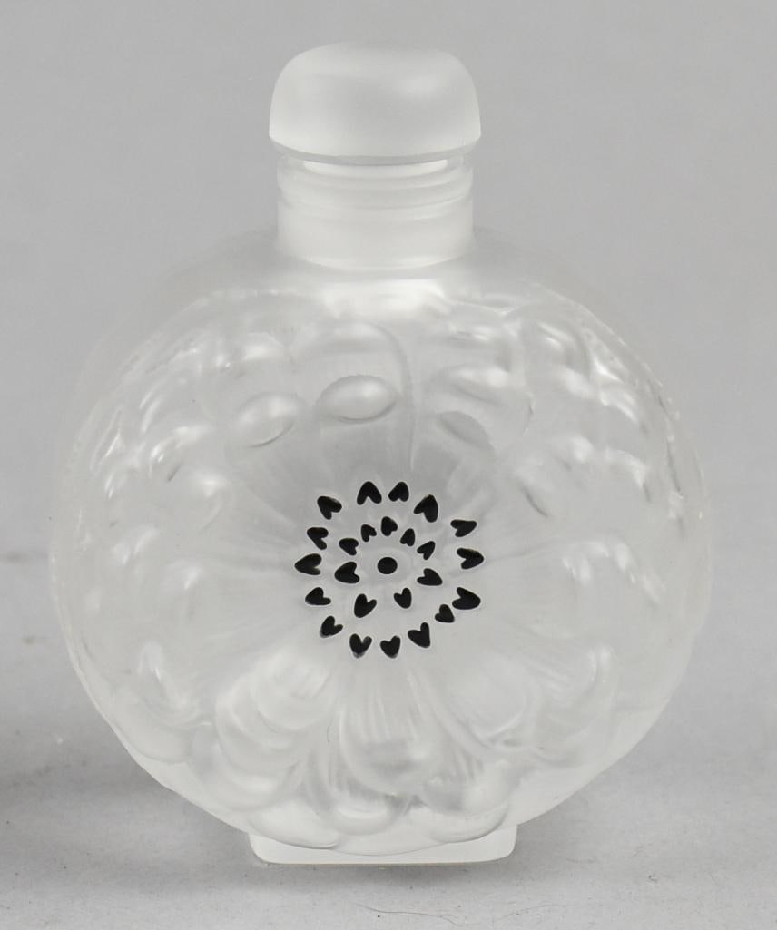 Lalique France Dahlia Frosted Crystal Perfume Bottle: Stunning piece of Lalique France frosted crystal. Perfume bottle is called Dahlia and is marked on the bottom. Measures approx. 3.5" tall x 3" wide.