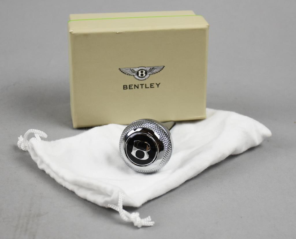 2015 Bentley Wine Bottle Stopper w/ Original Box: Cool bottle stopper from Bentley and is part of the Home Collection. Appears chrome and comes with dust bag and original box. Measures approx. 3.5" long.