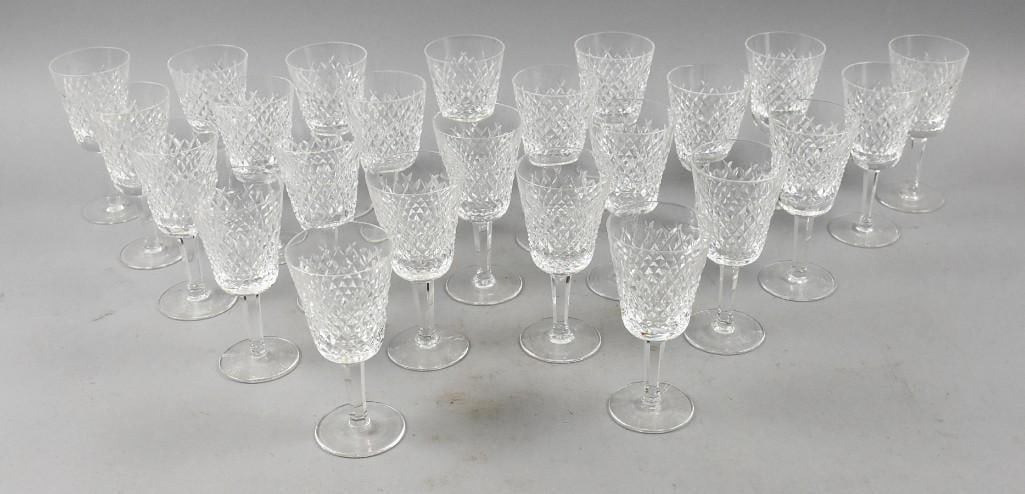 (24) 1952-2022 Waterford Crystal Alana White Wine Stems: Great lot of Waterford Crystal in the Alana pattern that ran from 1952-2022. There are 24 white wine stems that are approx. 5 1/2" tall and well marked. Great for the holidays.