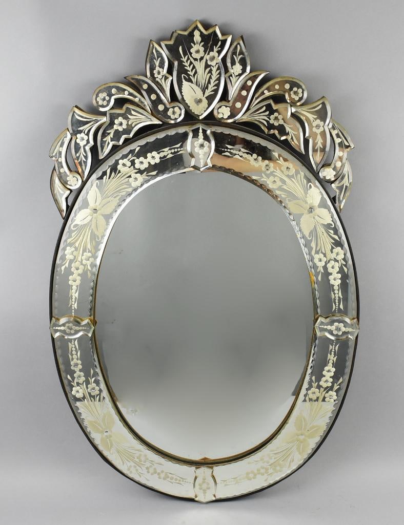Antique Venetian Art Glass Mirror Etched Mirrored Glass: This stunning mirror is Venetian glass and appears antique. Oval frame is mirrored with very pretty detailed floral motif, mirror appears original. No visible marks and measures approx. 35" tall x 22"