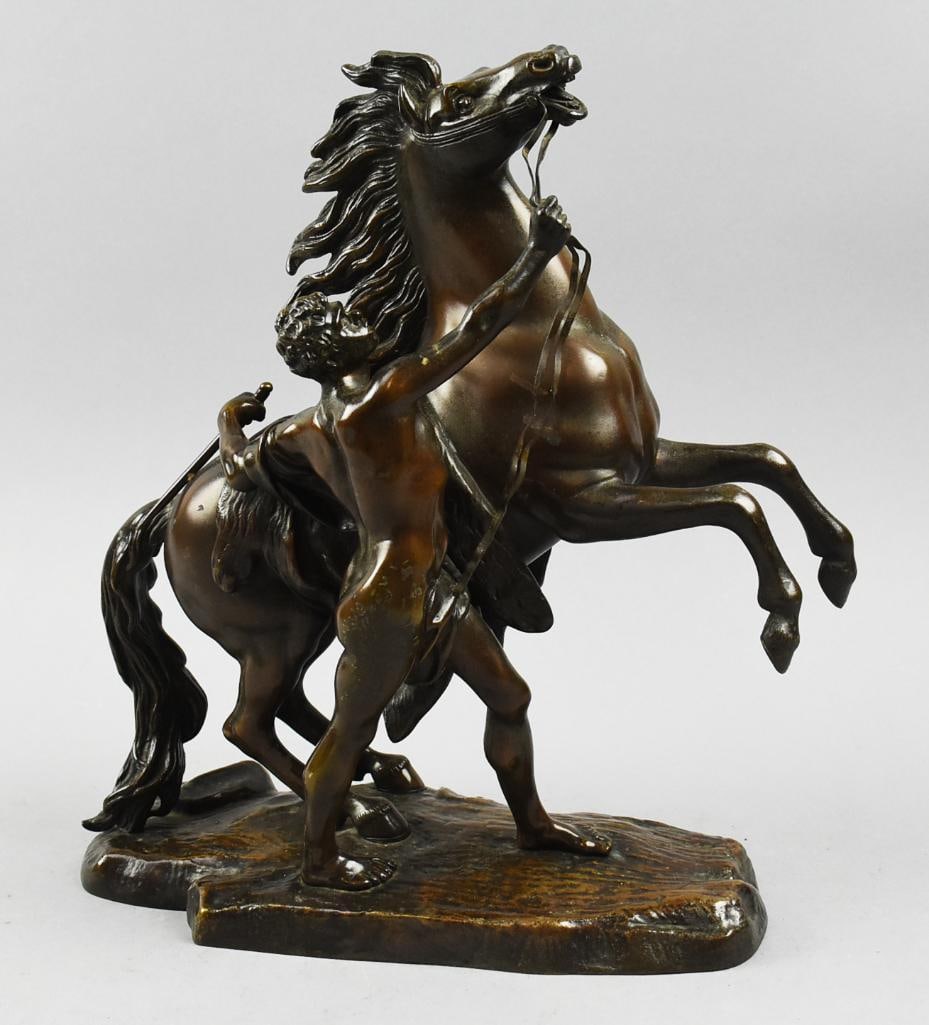 After Guillaume Cousteau (1677-1746) Marly Horse-Bronze: Great looking sculpture is after Guillaume Cousteau the Elder and is known as Marly Horse. The rearing horse is being handled by a man with a drape around his waist. Highly detailed with no visible ma