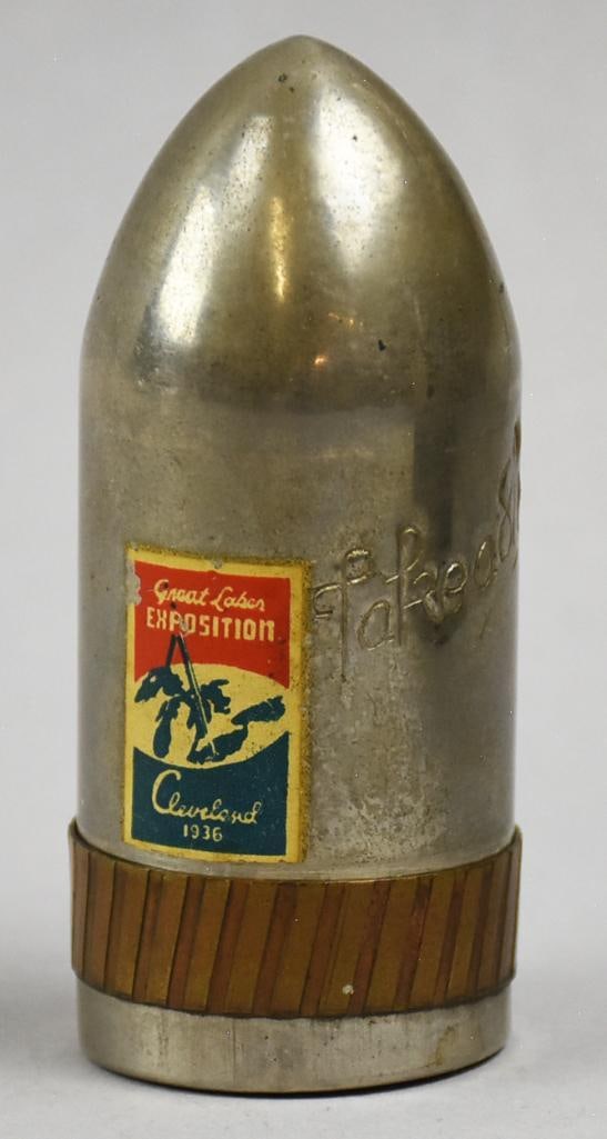 1936 Great Lakes Expo, Artillery Shell Shot Glass Set: This awesome set is for the traveling drinker! Cool chrome or chrome plated artillery shell with three shot glasses inside. Label on front is Great Lakes Exposition 1936 Cleveland. The side reads Take