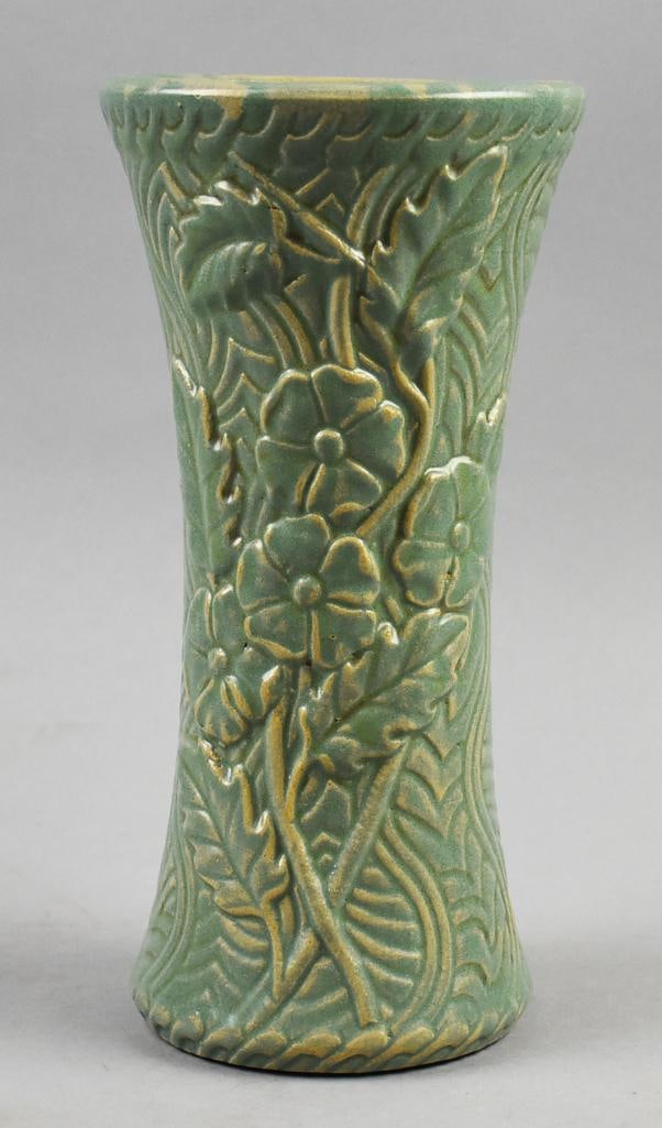 c1920 Burley-Winter Art Pottery Molded Vase: Wonderful piece of art pottery from Burley-Winter in Ohio. Tall molded flower and leaf with line details. Green matte glaze over yellow clay. Impressed mark on bottom and measures approx. 10.5" tall x