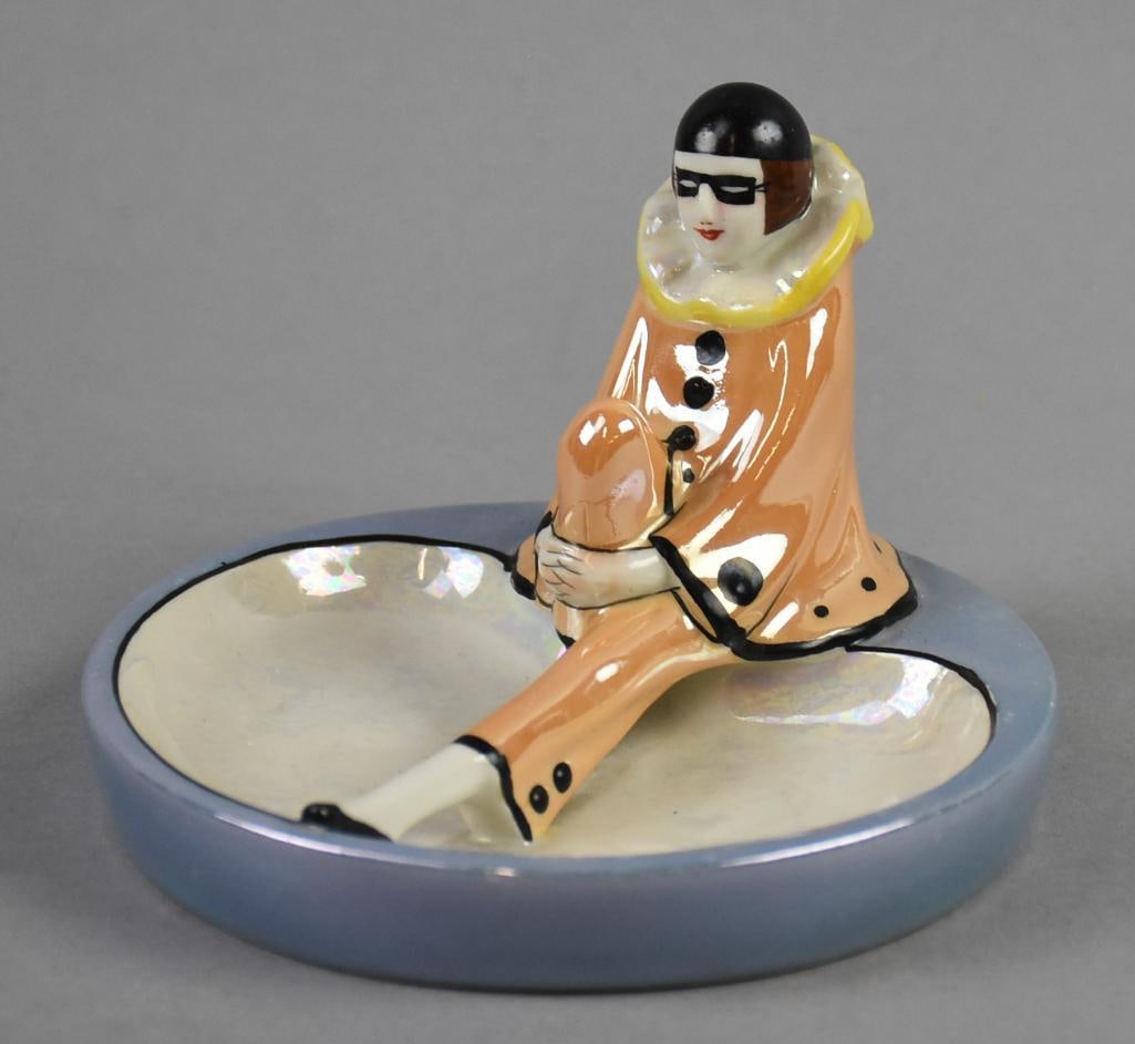 Art Deco Noritake Pierrot Ashtray, Luster Glaze: Very cool vintage Noritake porcelain ashtray, will make a cute trinket dish. Pierrot with orange luster glaze, seated on the edge of the dish with blue and white luster glaze and all black accents. Ma