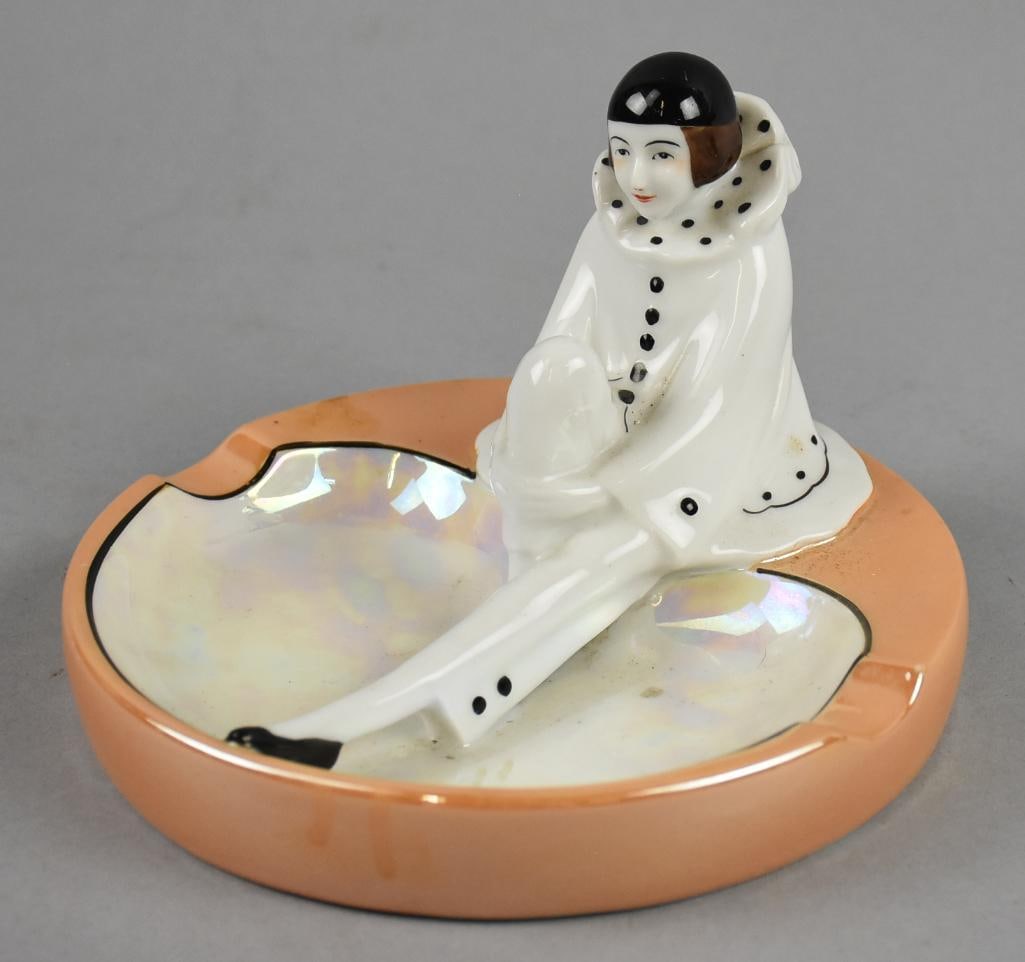 Art Deco Noritake Pierrot Ashtray, Luster Glaze: Cute vintage Noritake Pierrot ashtray that will make a great trinket dish as well. Pierrot is white with black glaze seated on the dish that is orange luster with white luster inside. Marked on bottom
