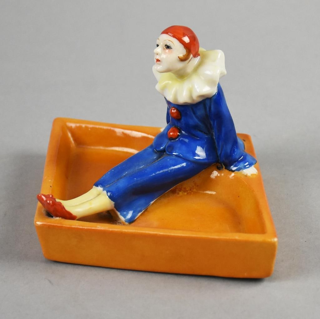 Art Deco Tashiro Shoten Pierrot Ashtray or Trinket Dish: Very cute vintage Tashiro Shoten hand painted ashtray, now great for use as a trinket dish. Pierrot in blue jumpsuit sits on the edge of an orange dish. Stamp marked on bottom TA and Made in Japan. Me