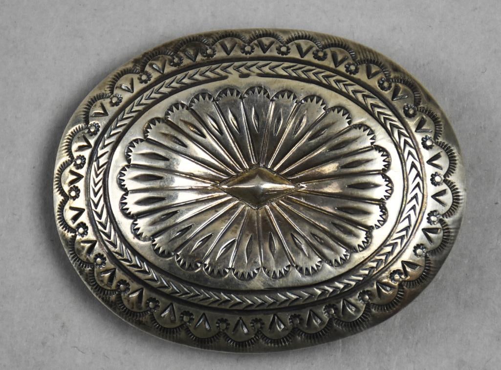Vintage Santo Domingo Clarence Bailon Sterling Buckle: This beautiful sterling belt buckle is Native American, Santo Domingo jewelry artist is Clarence Bailon. Concho style design will fit an approx 1" belt. Marked CB on back, tests as sterling with an ap
