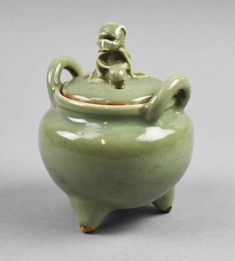 Vintage Japanese Celadon Glaze Ceramic Lidded Censer: This is a great piece of vintage Japanese ceramics. This celadon glaze piece is a censer. Lid with an abstract finial, tripod legs. Stands approx.?6" tall.?This piece was in a Japanese decor shop in L