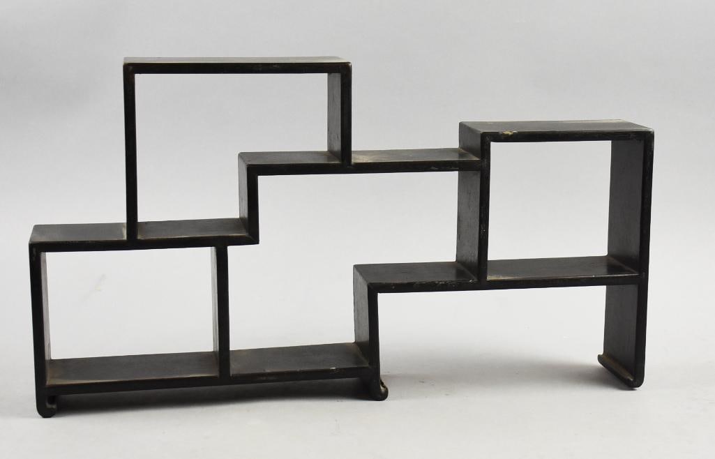 Vintage Asian Black Lacquer Display Shelf: Awesome vintage display shelf is Japanese in origin. Modular style shelving with black lacquer. Retains original label on bottom Made in Hong Kong and measures approx. 10" tall x 18" x 3".