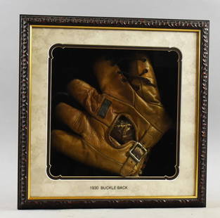 1930 Buckle Back Baseball Glove, Shadowbox Frame: This is a great leather baseball glove from 1930. It has been framed in a nice shadowbox. Leather laces with metal back buckle. Unknown manufacturer. Frame measures 16" x 16", possibly a Davega