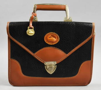 Dooney & Bourke Leather Carrier Bag: Nice designer carrier bag from Dooney & Bourke. In the signature pebbled leather with brown trim and locking clasp. Measures approx. 9" x 12".