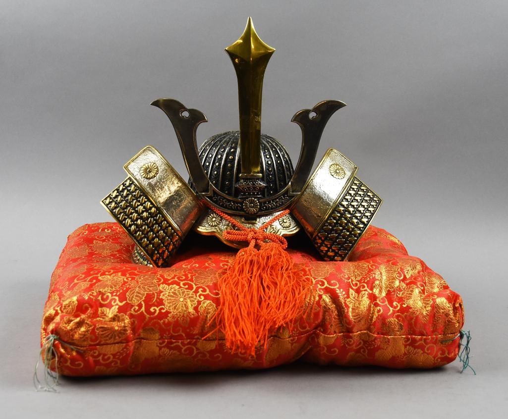Vintage Japanese Cast Iron Samurai Helmet w/ Pillow: Awesome vintage Japanese cast iron helmet. This Samurai piece has been silvered with gold accents and comes with the display pillow that appears satin. Measures approx. 10.5" tall x 12". This piece wa