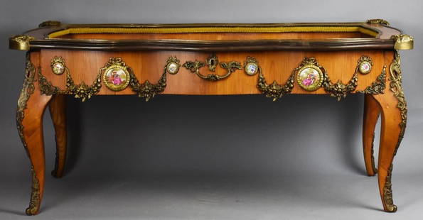 Louis XIV Style Vitrine Coffee Table, Ormolu Mounts: Beautiful vitrine coffee table in the Louis XIV style. Per the receipt, it is rosewood, but veneer. Open hinged top with gold velvet lining. Applied ormolu embellishments and Victorian style