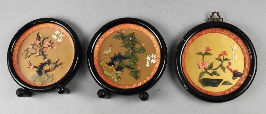 Vintage Chinese Hardstone Plaques: Nice set of three vintage plaques. All are of Chinese origin with carved hardstone that appears to be both jade, coral and others. All with foliate designs and two with birds. One has a hook at the to