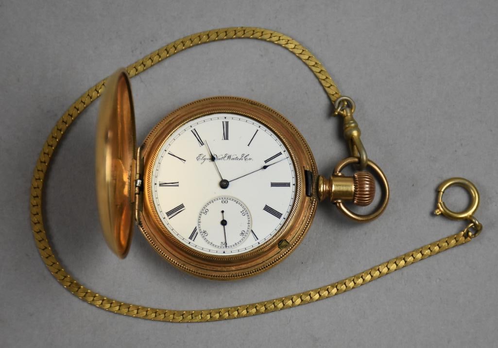 Working c1893 Elgin 15 Jewely Gold Fill Hunter Case Pocket Watch: Stunning antique victorian pocket watch from Elgin National Watch Co. Hunter case is gold filled with light engravings of scrolls and a small house on one side, owner's name and date of 1892 on the ot
