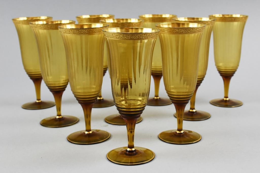 10 Vintage Gold Rimmed Goblets Tiffin: Vintage set of 10 amber colored glass goblets with gold gilt rims and elongated tulip-form ribbed bowls. These match the other lot of gold rimmed glasses.