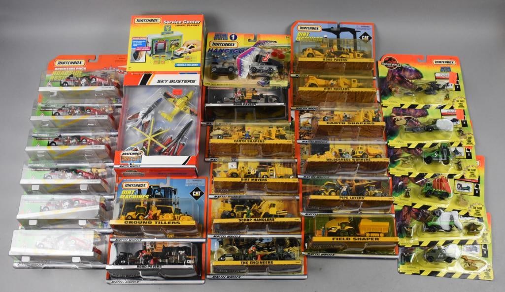 (28) 1993, 1997-98 Matchbox 1/64 Die Cast-MOC-NOS: Lot is 28 1993, 1997-98 Matchbox 1/64 Die Cast-MOC-NOS. Lot is a 1993 Service Center Playset and Car, Hero City Sky Busters four plane set, six 1997 Adventure Pack Roadside Assistance, seven 1997 Acti