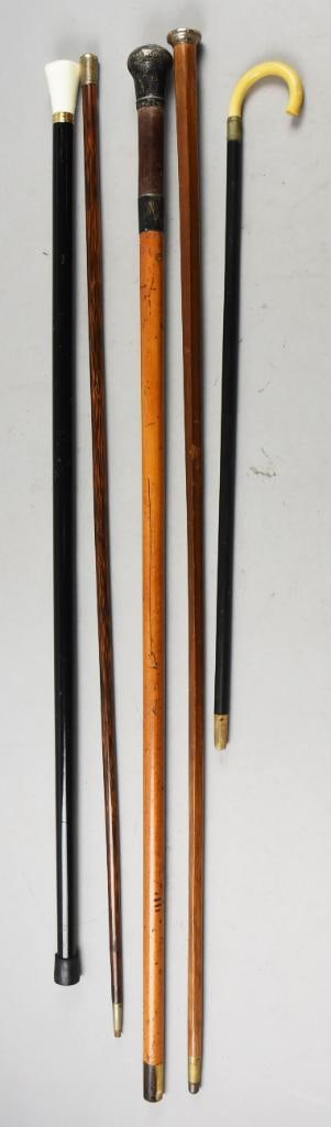 (5) Vintage/Antique Walking Sticks, Sterling Caps: Nice assortment of vintage and antique walking sticks. Three have sterling silver caps. One with hammered silver is London sterling from M. Jacobs & Co (Benjamin Jacob) with the letter "a" indicating
