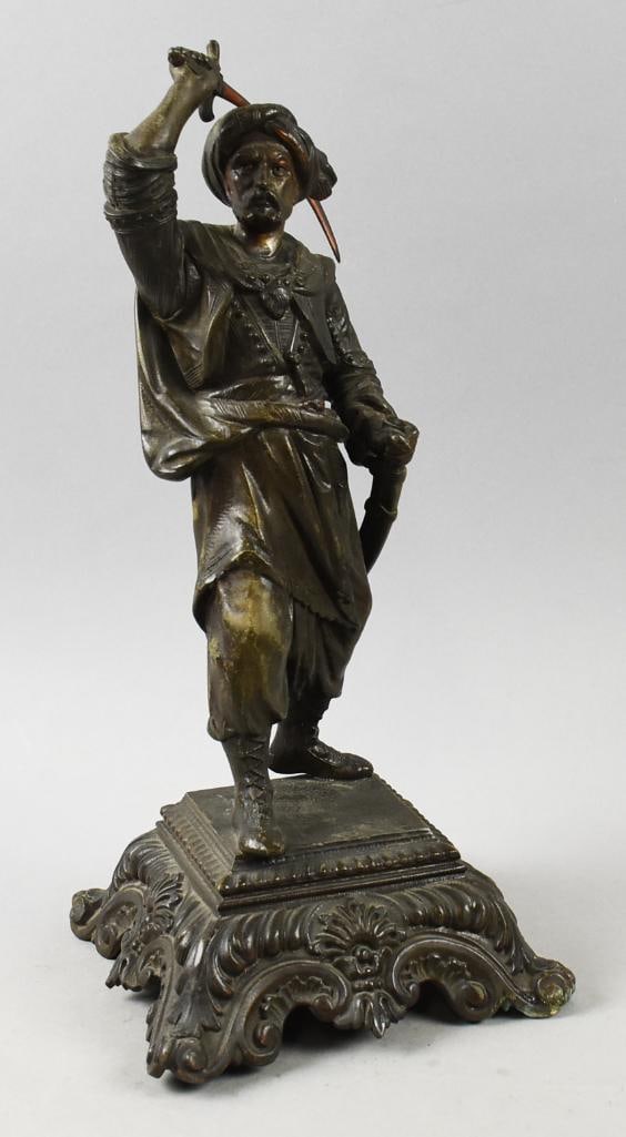 Victorian Signed Arab Warrior Sculpture: This awesome sculpture appears mixed metal and is in the form of an Arab Warrior. Is in a defensive stance with right arm raised wielding a sword. Inside the ornate base are embossed marks, 1892, appe