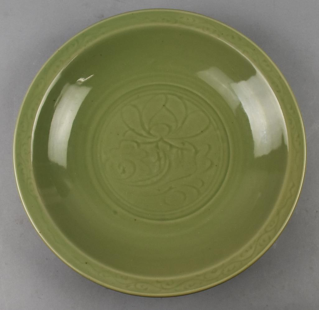 Vintage Chinese Incised Ceramic Bowl, Celadon Glaze: Gorgeous vintage bowl of Chinese origin. The center of the bowl is incised floral and scrolls around rim with a heavy celadon glaze. No visible marks and measures approx. 17" across.