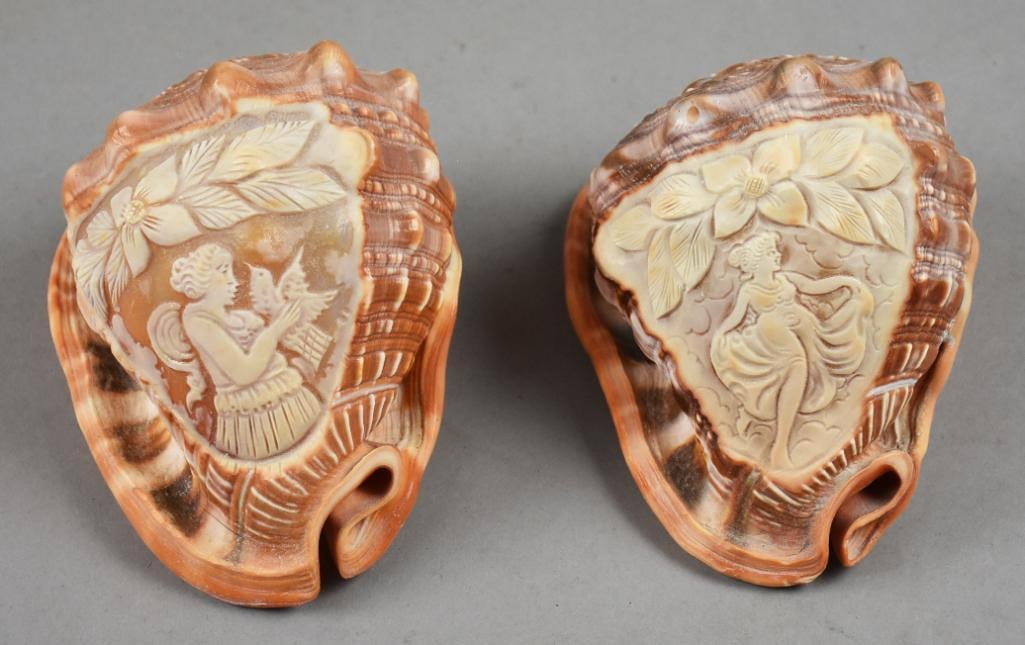 Victorian Conch Shells, Cameo Carved Ladies: Pair of stunning conch shells from the Victorian era. Each shell is hand carved in cameo style with one lady holding a dove, one lady dancing. both approx. Each measure approx. 6" long x 4" tall.