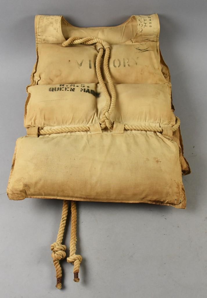WWII Era Queen Mary Troopship Life Vest: This is an amazing piece of history from the famous RMS Queen Mary from the famous Cunard-White Star Line. During WWII, she was used as a troopship along with her sister ships, carrying New Zealand an