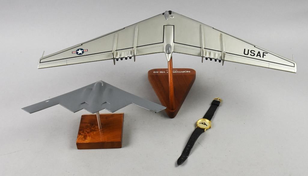 US Air Force, Northrop Desktop Aircraft & Watch: Nice grouping of US Air Force collectibles. All are Northrop and include a B-2 Criterion wristwatch, B-2 desktop model and a YP-49. Models measure approx. 11" x 3.5" tall and 21" x 6.5" tall.