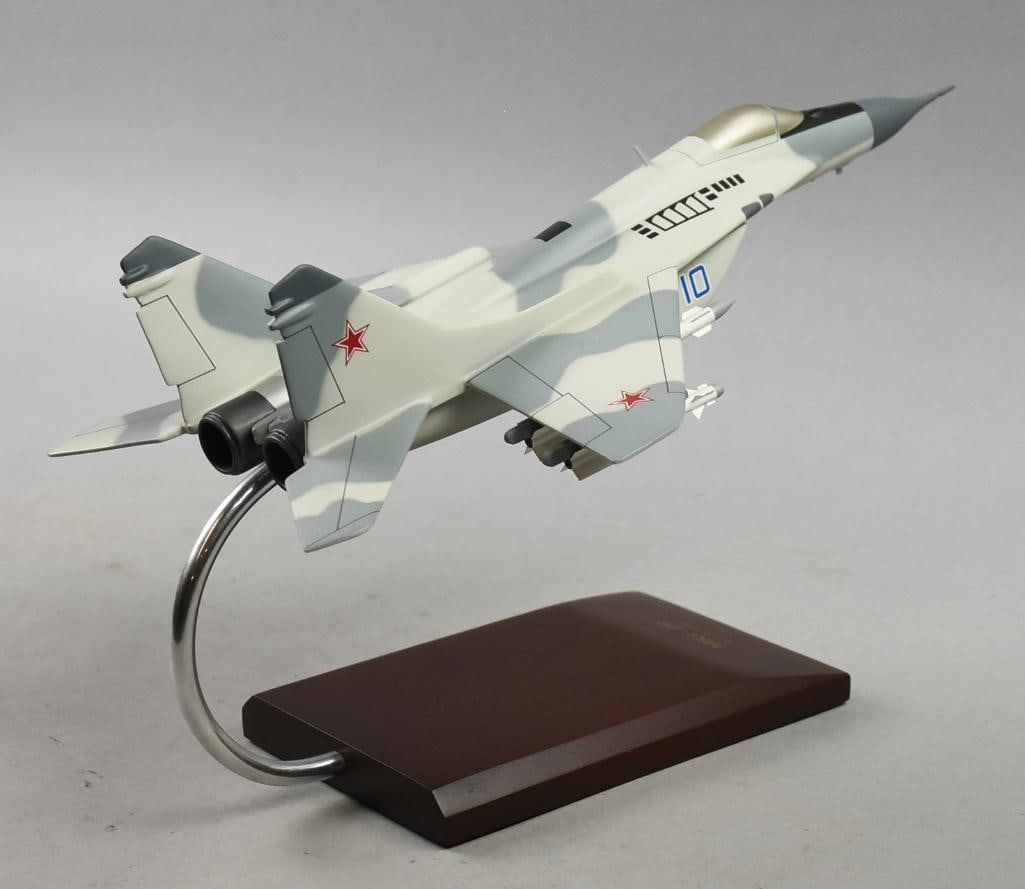 Scalecraft MIG-29 Fulcrum Desktop Model 1/48: Very cool scale airplane model from Scalecraft. It is a MIG-29 Fulcrum fighter plane in 1/48 scale. It is attached to wooden base and measures approx. 9" x 14" x 8" tall.